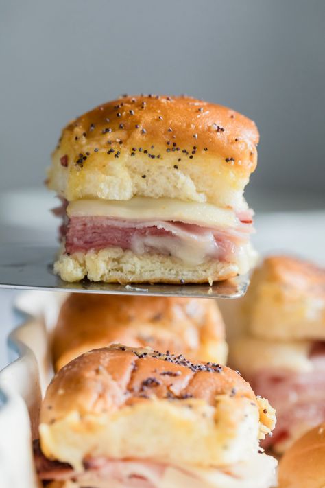 Funeral Sandwiches are delicious ham and cheese sliders you can make as an easy appetizer recipe or as a family friendly meal. Full of warm salty ham, nutty Swiss cheese and topped with a tangy Dijon butter sauce, these mini slider sandwiches are nothing to be sad about! Make Ahead Slider Sandwiches, Best Party Sandwiches, Cold Sliders Recipes, Slider Sandwich Ideas, Little Hammies Sandwiches, Fancy Ham And Cheese Sandwiches, Ham And Cheese Poppyseed Sliders, Ham And Cheese Finger Sandwiches, Poppyseed Ham And Cheese Sliders