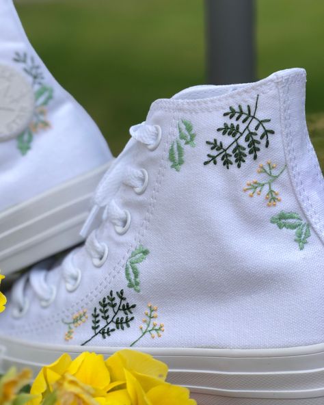 Why blend in when you can stand out from the crowd? These custom trainers take the classic Converse high tops and transform them into unique pieces of wearable art. I only purchase 100% genuine shoes from the official converse website. I then use high quality embroidery thread to embellish both sides of the converse with a dainty flower design. Sizes are in standard woman UK sizes. **Because each pair of trainers are made to order I do not provide refunds if the shoes do not fit, so be sure that Cross Stitch Converse, Converse Embroidery Ideas, Embroidered Shoes Diy, Embroidery Shoes Diy, Custom Trainers, Wedding Trainers, Embroidery Converse, Converse Embroidery, Embroidery Jeans Diy