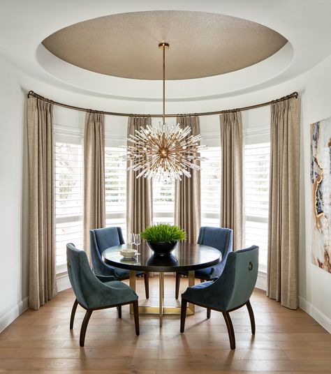 This lovely breakfast area with sputnik chandelier is part of a whole house remodel by Haven Design and Construction.  The round ceiling is wallpapered in a metallic cork that picks up the colors in the drapery and modern artwork on the adjoining wall.  A custom curved drapery rod and floor length linen drapery finishes off the look. Big Dining Table, Large Round Dining Table, Cork Wallpaper, Open Floor Plan Kitchen, Grey Kitchen Floor, Transitional Dining Room, Wallpaper Ceiling, Round Dining Room, Dining Room Combo