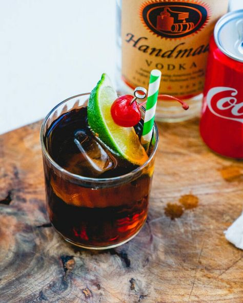 Vodka and Coke is the ultimate easy vodka cocktail! Here's the ratio for how to make it and a few ideas on how to step it up. #vodkaandcoke #vodkacocktail #easycocktail #vodka #coke #cocacola #cocktail Coke And Vodka Drinks, Vodka Coke, Coke Drink, Vodka Cocktails Easy, Vodka Drinks, Vodka Cocktails, Lime Wedge, Easy Cocktails, Coca Cola