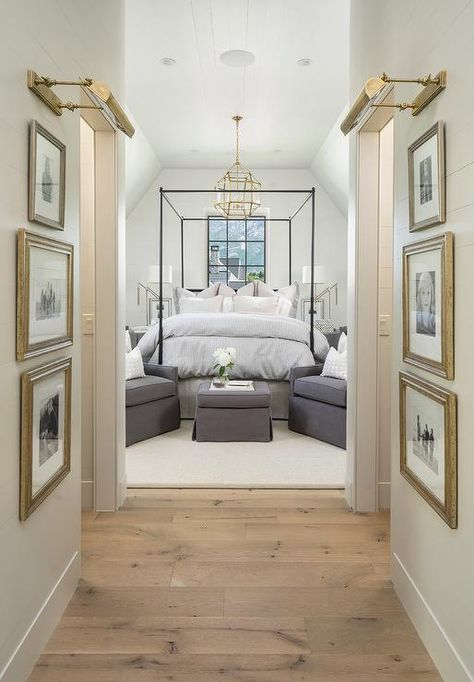 Pine wood floors separated shiplap hallway walls accented with gold leaf framed black and white photography lit by brass picture lights. Decor Ikea, Timeless Interiors, Interior Vintage, Foyer Design, Beautiful Bedroom, Studio Mcgee, Remodel Bedroom, Awesome Bedrooms, Wood Flooring