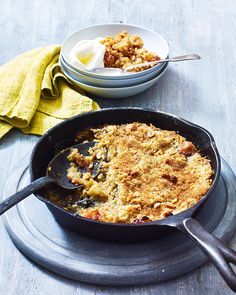 The classic British dessert just got a lot easier and a whole lot more satisfying with this one-pan recipe. An easy-to-make toffee and apple crumble is great for entertaining or a lovely way to end a family meal. Apple Flapjack, British Pudding, October Food, British Desserts, Fruit Crumble, Bread And Butter Pudding, Toffee Apple, Delicious Magazine, Crumble Recipe