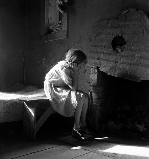 Resettled farm child from Taos Junction to Bosque Farms project. New Mexico. Photograph by Dorthea Lange for the Farm Security Administration, December 1935. - one of my fave photographers! Dorothea Lange Photography, Sitting On A Bench, Dust Bowl, Farm Projects, Documentary Photographers, Taos, Old Photographs, Documentary Photography, Black White Photos