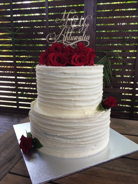 Two tier vanilla buttercream cake with fresh red roses and personalized cake topper Two Tier Quinceanera Cake, Real Roses On Cake, Wedding Cake With Roses 2 Tier, White Cake Red Roses, White And Red Birthday Cake, Cake With Roses On Top, Vanilla Buttercream Cake, Wedding Cake Icing, 25th Wedding Anniversary Cakes