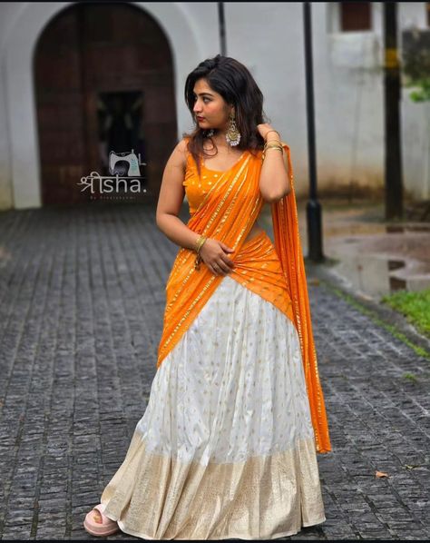 Orange Half Saree Color Combos, Dhavani Half Saree Color Combos, Davani Half Saree Kerala, White Half Saree, Orange Half Saree, Skirt And Top Indian, Full Skirt And Top, Function Dresses, Traditional Hairstyle