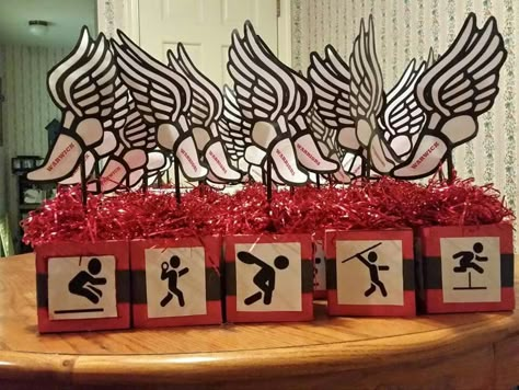 Track and field center piece Senior Night Ideas Track And Field, Track And Field Party Ideas, Track And Field Centerpiece Ideas, Track Senior Night Gifts, Track Themed Party, Track And Field Birthday Party Ideas, Senior Track Gifts, Track Centerpiece Ideas, Senior Night Gift Ideas Track