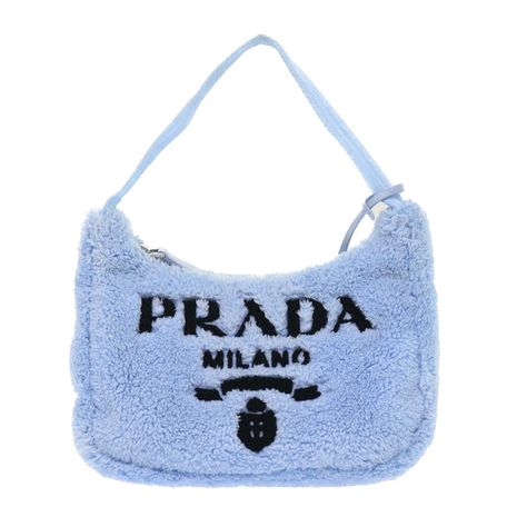 Brand: Prada Model: Re-edition Color: Blue Material: Fur Inclusions: Dust Bag / Item Box / Charm Dimensions: W22cm x H17cm x D7cm Serial number: 31/A3 Country of origin: Italie Condition: A - excellent condition. If you have a preference for a relaxed and contemporary style, this Re-edition bag from PRADA is an ideal choice! Its exquisite design attracts fashion-conscious individuals, especially women . The exterior surface, interior, and corners of the item are all in excellent condition ... Prada Reedition, Prada 2000, Prada Mini, Prada Re Edition, Fur Handbags, Bag Prada, Dion Lee, Yohji Yamamoto, Thom Browne