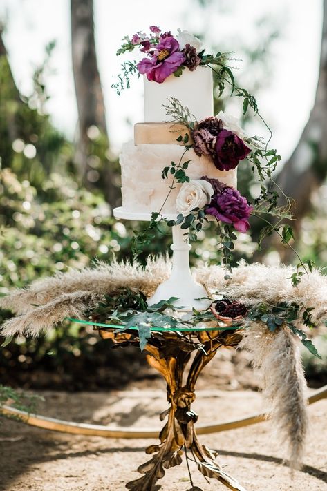 Burlap & Bordeaux | White wedding cake, cake stand, gold cake stand, wedding trends, wedding cake with plum and feather details Plum Wedding Cake, Bordeaux Wedding, Rosette Cake Wedding, Metallic Wedding Cakes, Gold Cake Stand, Moody Vibes, Wedding Cake Prices, Wedding Cake Ombre, Edgy Wedding