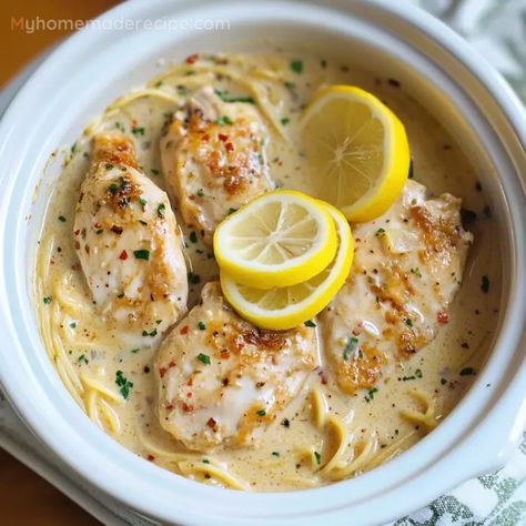 Lemon Chicken Pasta Crockpot, Lemon Garlic Chicken With Creamy Bowtie Pasta, Lemoncello Chicken, Lemon Crockpot Chicken, Crockpot Lemon Garlic Butter Chicken, Lemon Chicken Crockpot, Crockpot Lemon Chicken, Slow Cooker Lemon Garlic Chicken, Lemon Garlic Chicken Pasta