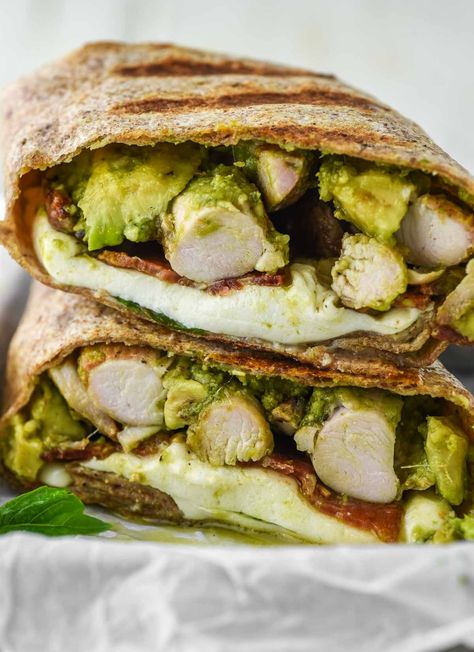 Filled with chicken, homemade pesto, avocado, bacon and cheese, this chicken pesto wrap is simple, filling, and delicious. #chickenpestowrap #chickenwrap #wrap | chiselandfork.com Pesto Chicken Wrap, Chicken Pesto Panini, Pesto Wrap, Pesto Meatballs, Avocado Wrap, Pistachio Pesto, Mozzarella Recipes, Chicken Pesto, Avocado Pesto