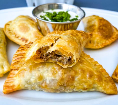 This Easy Beef Empanadas Recipe is the perfect appetizer loaded with ground beef, melted cheese, and seasoned to perfection with homemade taco seasoning. The dish comes together quickly using Goya empanadas wrappers. This South American and Puerto Rican dish is perfect for any gathering, including Cinco de Mayo. Fried Beef Empanadas Recipe, Empanadas Recipe Beef And Cheese, Goya Empanadas Recipe, Easy Beef Empanadas Recipe Air Fryer, Mexican Beef Empanadas, Dominican Beef Empanadas Recipe, Cheese Empanadas Recipe, Beef Empanadas Recipe, Cheese Empanadas