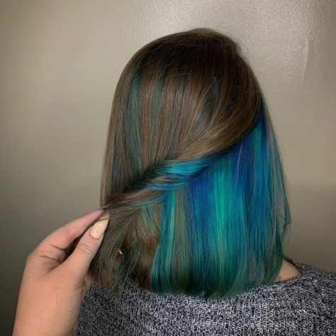 Peekaboo highlights: Woman with dark brown shoulder length bob with hidden blue and green highlights Blue Hair Color Highlights, Hidden Hair Color, Blue Hair Highlights, Peekaboo Hair Colors, Underlights Hair, Peekaboo Highlights, Hair 101, Peekaboo Hair, Hair Color Streaks