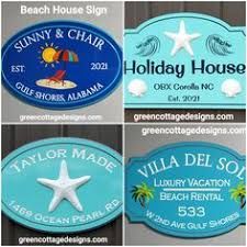 130 COTTAGE NAME SIGNS greencottagedesigns.com ideas in 2021 | cottage signs, beach house signs, cottage names House Sign Ideas, Lakehouse Vacation, Farm Beach House, Outdoor Beach House, Residential Signs, Beach House Names, Luxury Beach Vacation, Farm Wedding Venues, Ocean Cottage