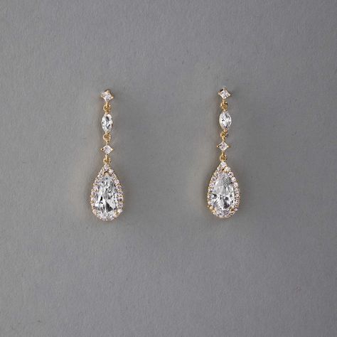 Enhance your bridal ensemble with these exquisite wedding earrings featuring a pave set elongated pear drop, delicately suspended from petite round and marquise CZ stones.They are 1.5 inches long, post pierced backs, rhodium, rose gold or gold plated, grade AAA CZ stones, lead, cadmium, and nickel free. Gold Crystal Earrings, Wedding Earings Idea, Maid Of Honor Earrings, Homecoming Earrings Gold, Wedding Earrings For Bride, Prom Jewlrey Looks Gold, Gold Earrings Formal, Prom Jewlrey Looks, Gold Crystal Earrings For Wedding