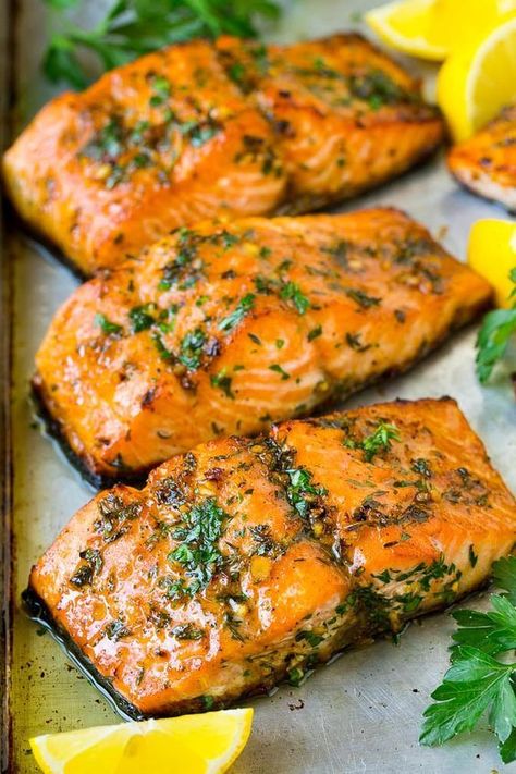 This recipe for baked salmon is fresh fish fillets topped with garlic, butter and herbs, then roasted to tender perfection. A super easy dinner option. @DinnerattheZoo Oven Roasted Salmon Recipes, Salmon Toppings, Fry Potatoes, Roasted Salmon Recipes, Salmon Roasted, Oven Baked Salmon Recipes, Oven Salmon, Herb Salmon, Fish Meals