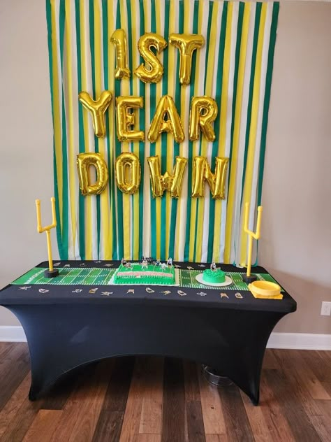 Football themed 1st birthday 1st Year Down Football Birthday Decorations, First Down Football Birthday Party Food, Football Decorations Diy, 1st Birthday Themes Boy, First Down Birthday, Diy 1st Birthday Decorations, Themed 1st Birthday, Football Birthday Party, 1st Birthday Themes