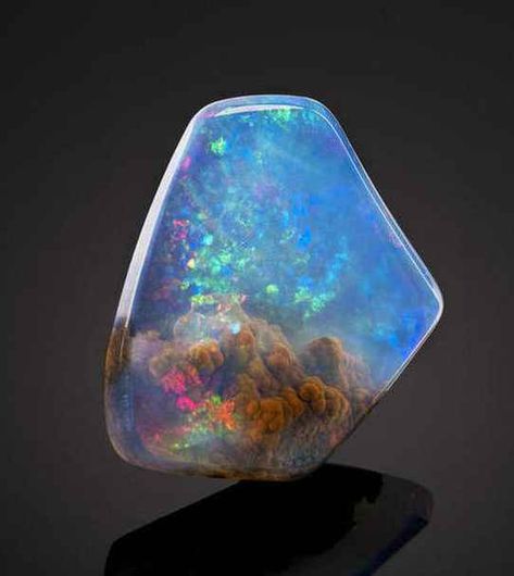 This is an American Contra Luz Opal. | This Beautiful Gemstone Looks Like It Contains A Small Nebula Luz Opal, Pretty Rocks, Beautiful Rocks, Mineral Stone, Minerals And Gemstones, Rocks And Gems, Precious Gems, Gems And Minerals, Stone Rocks