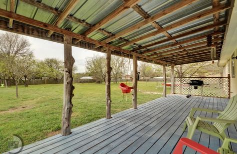 Back Porch Life Raw Cedar post, weathered plank floor, and tin roof. Tin Roof Porch, Tin Roof Patio, Roof Porch, Magical Backyard, Dream Porch, Cedar Posts, Porch Life, Porch Addition, Roof Covering