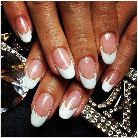 Looking for a classy and luxurious way to show your love for gold? Try gold french tips nails! With their sleek design and shiny finish, these nails will make you look and feel like a million bucks. French Tip With Gold Glitter Line, French Manicure Gold Line, Gold Line French Tip, White French Tip Nails With Gold Line, Gold Lined French Tip Nails, Gold Lined French Tips, White French Tips With Gold Line, French Manicure With Gold Line, French With Gold Line