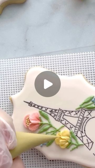 Mary Mansfield on Instagram: "As promised, here is more of the floral piping from the Eiffel Tower cookie. IG clipped the video I shared previously, so I’ve sped it up a wee bit and edited to be less than a minute. The final steps on the flowers really add so much, so I’ll hope you’ll watch till the end. 

I used tip 103 for the flowers and my @tweetscookieconnection edible fine tip marker with my PICO projector to draw the tower. 
.
.
.
.
#cookietutorial #cookievideo
#floralpiping #eiffeltowercookies #weddingcookies
#cookiedecorating
#decoratedcookies  #cookiesofinstagram #royalicingcookies" Floral Piping, Royal Cookies, Pico Projector, Cookie Videos, Cookie Tutorials, Wedding Cookies, Royal Icing Cookies, The Eiffel Tower, The Tower