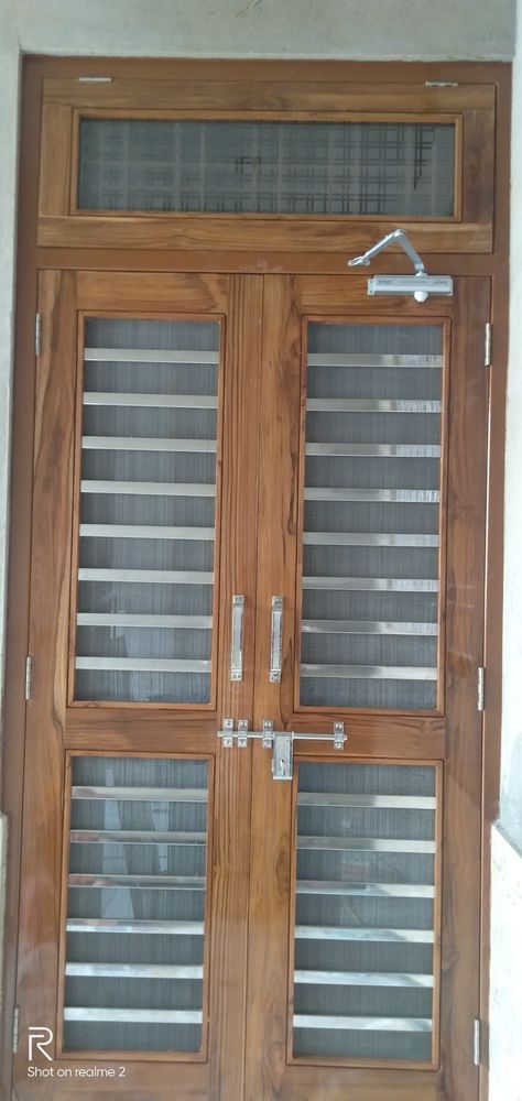 Double Jali Door Design Modern Wooden, Mesh Double Door Design Wooden, Wire Mesh Door Design Wooden, Jaali Door Design, Double Door Design Wood Jali, Jali Gate, Jaali Door, Interior Design Under Stairs, Jali Door