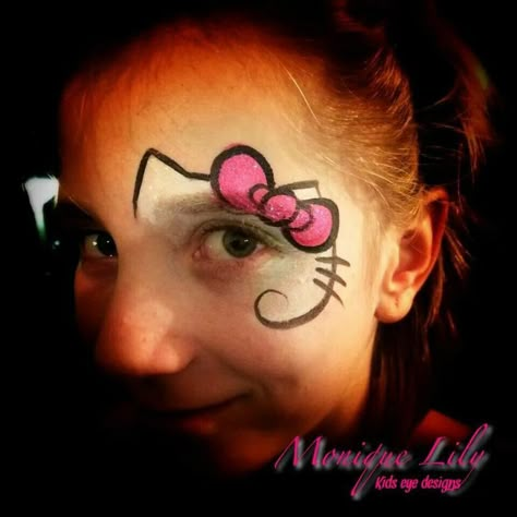 Hello Kitty Facepainting, Hello Kitty Face Paint Easy, Hello Kitty Face Paint, Kitty Face Paint, Girl Face Painting, Cheek Art, Hello Kitty Face, Super Hero Shirts, Eye Designs