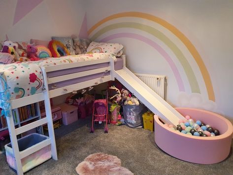 Girls rainbow dream room. Art deco painted wall. Rainbows and unicorns. Mid sleeper bed with slide and ball pit. Bunk Bed With Slide And Ball Pit, Bed With Slide For Girls Fun, Loft Bed Ideas With Slide, Mid Sleeper Girls Room, Unicorn Rainbow Room Ideas, Unicorn Bunk Bed, Mid Sleeper Bed Ideas, Arias Bedroom, Rainbow Bedroom Ideas Kids