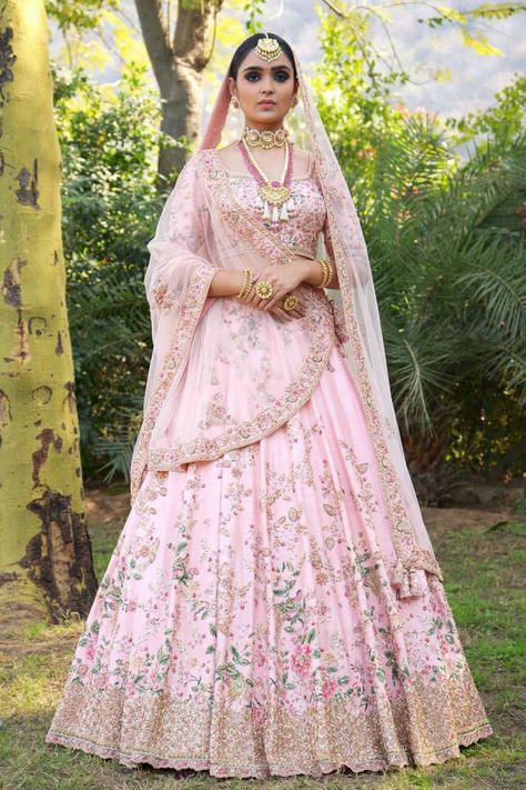 Lehenga is a delicate pink color with heavy embellished work worn with pale peach color odhni and a silver choli Pink Bridal Lehenga, Orang India, Wedding Lehenga Designs, Bridal Lehenga Collection, Designer Bridal Lehenga, Indian Bridal Lehenga, Bridal Lehenga Red, Gaun Fashion, Pink Lehenga