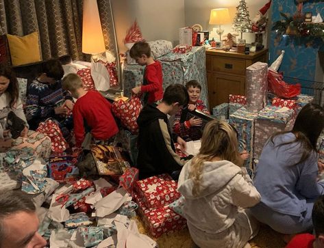 CHRISTMAS Day is often a noisy, playful event in many households, but spare a thought for Britain’s biggest family.  Parents-of-22 Sue, 45, and Noel, 49, Radford shared a sneak peek into what life looks like on December 25 on their YouTube channel – and it does look like chaotic fun.  Lounge covered in presents Last […] Christmas Gift Opening, Opening Christmas Presents, Hogwarts Express Train, Family Christmas Dinner, Family Christmas Pictures, Family Stockings, Family Presents, Vintage Christmas Gifts, Personalized Gift Bags