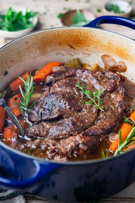 Tender and juicy, this Dutch Oven Pot Roast transforms an affordable cut of meat into a delicious comfort food dinner. The beef slowly bakes with potatoes and carrots for an easy one pot meal. Your whole family will love this classic Sunday pot roast recipe! Roast In Dutch Oven, Cross Rib Roast, Dutch Oven Pot Roast, Oven Pot Roast, Chuck Roast Recipes, Best Dutch Oven, Paleo Mom, Beef Dinners, Beef Pot Roast