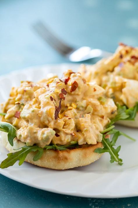 Traditional egg salad gets a big flavor boost with a spicy avocado mixture! The avocado is creamy so you need less mayo! Perfect in a salad or sandwich for easy lunches! macheesmo.com #eggsalad #avocado #spicy #easyrecipes #lunches Spicy Egg Salad Sandwich, Eggsalad Avocado, Egg Salad Sandwich, Salads Recipes, Avocado Egg Salad, Egg Salad Sandwiches, Hearty Salads, Egg Salad Recipe, Healthy Lunchbox