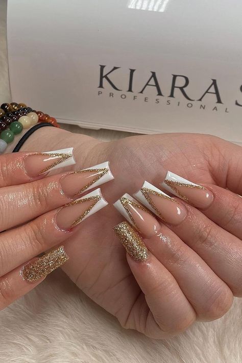 Coffin White And Gold Nails, Champagne Acrylic Nails Coffin, Gold Nails Coffin Shape, Gold And White Glitter Nails, French Tip With Gold Rhinestones, V French With Glitter, White And Gold French Manicure, Gold And French Nails, French With Color Nails