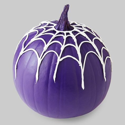 Mix things up this year with a purple pumpkin. Then drape it with a caulk spiderweb. Click this pin for our simple pattern and instructions. Pumpkin Spray, Pumpkin Painting Party, Pumpkin Decorating Ideas, No Carve Pumpkin Decorating, Pumpkin Carving Designs, Purple Pumpkin, Pumpkin Designs, Halloween Pumpkins Painted, Pumpkin Projects