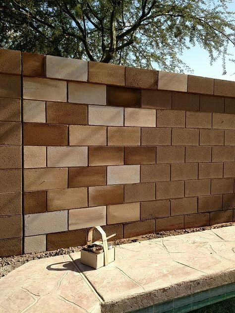 Painting a cinder block wall gives it a really cool effect, I love these  contrasting browns! Decorating Cinder Block Walls, Cinder Block Paint, Cinder Block Garden Wall, Cinder Block House, Decorative Concrete Blocks, Paint Concrete Patio, Garden Blocks, Concrete Block Walls, Cinder Block Garden