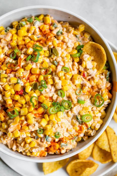 BEST easy recipe for cheesy, creamy Mexican Corn Dip with Greek yogurt (in place of sour cream), jalapeno, cheese, and Mexican spices. Ready in 10 minutes and a total crowd pleaser! This easy dip recipe is perfect for tailgating, game watches, parties and more. Served cold or room temperature. #wellplated #dip #corndip Mexican Corn Dip Recipe, Spicy Corn Dip, Creamy Corn Dip, Mexican Corn Recipes, Corn Dip Recipe, Mexican Corn Dip, Mexican Street Corn Dip, Cream Cheese Corn, Corn Dip Recipes