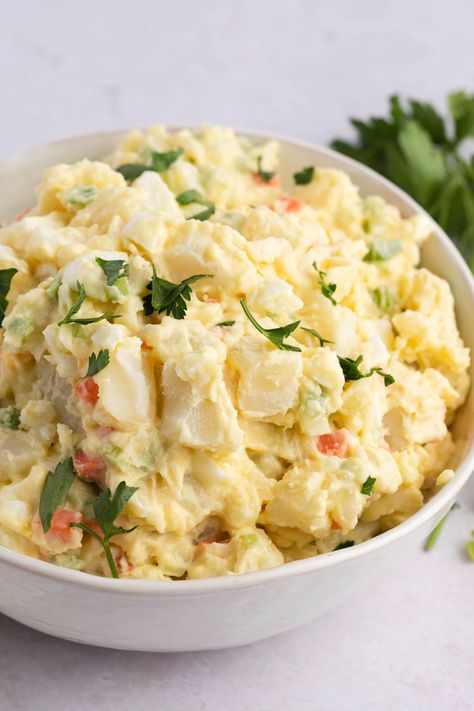 This Amish potato salad will be the hit of any potluck! Learn how to make the easy recipe, and get tips for the creamiest, most delicious potato salad. Amish Potato Salad, Amish Potato Salads, Deviled Egg Potato Salad, Potato Salad Recipes, Homemade Potato Salads, Little Sunny Kitchen, Southern Potato Salad, Potato Salad Dressing, Sunny Kitchen