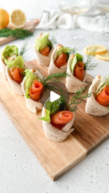 Kristel Talie on Instagram: "Smoked Salmon Canapés✨ 

Little bread envelopes filled with cream cheese, dill and smoked salmon💌 They are the perfect savory bites for entertaining or simply to enjoy as a snack😋

You’ll need

Slices of white bread
Smoked salmon
Cream cheese
Lettuce
Dill
Lemon slices for serving

Cut the bread in 2 parts diagonally and then flatten with a rolling pin. Take the 2 far ends of one bread part and fold making an envelope. Secure with a toothpick. Bake at 180C for 5 minutes or until the edges turn golden. Let them cool before removing the toothpicks. Fill each bread envelope with cream cheese, a small piece of lettuce, a rolled slice of smoked salmon, and some fresh dill. Serve with fresh lemon slices and enjoy!🍋

#fingerfood #partyideas #smokedsalmon #canapes #f Cream Cheese Board, Making An Envelope, Smoked Salmon Canapes, Salmon Canapes, Smoked Salmon Cream Cheese, Salmon Appetizer, Entertaining Appetizers, Salmon Cream Cheese, Pizza Appetizers