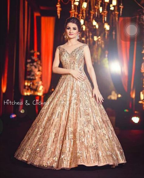 The 25 Wedding Weekly Trends – Editor’s Choice. - ShaadiWish #shaadiwish #manishmalhotra #manishmalhotraoutfits #bridaloutfits #bridaloutfitideas #bridalwear #bridalgown Engagement Dress For Women, Engagment Dress, Gorgeous Lehengas, Engagement Dress For Bride, Bride Reception Dresses, Engagement Gown, Reception Outfits, Party Dresses With Sleeves, Bridal Trousseau