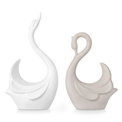 This 2-piece swan figurine set adorn your surface space into your decor to add depth and texture to your home. An artistic display to showcase your personality and enhance the look of any open tabletop space. Made from ceramic with a symmetry coffee and white finish, this set includes 2 stylized swans with different sizes towards opposite direction. Display together or separately in the living room, study, home office, and watch as they enhance your surrounding design scheme. No matter where the Swan Sculpture, Swan Ceramic Sculpture, Swan Teapot, Swan Bookends, Swan Vase, Swan Figurine, Cosmoliving By Cosmopolitan, White Coffee, Animal Figurines