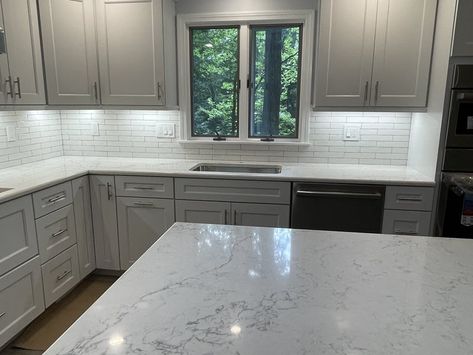 White Grey Countertops, White And Grey Countertops, White Subway Tile Herringbone, Installing Granite Countertops, Light Granite, Grey Subway Tiles, Countertop Options, Dark Wood Cabinets, Grey Countertops