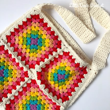 Happy Rainbow Granny Square Bag Pattern Crochet Project Patterns, Granny Square Bag Pattern, Granny Square Handbag, Rainbow Granny Square, Granny Square Bags, Square Bag Pattern, Crochet Hand Bag, Crochet Purses And Bags, Granny Square Purse