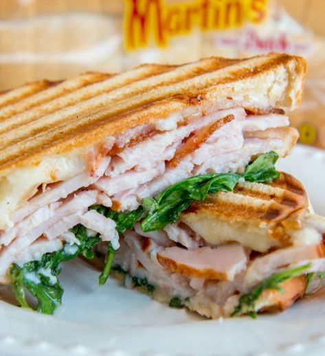 This warm and melty grilled sandwich is made with creamy Havarti cheese, thick-cut turkey, sweet or savory spread, bacon, and arugula, all on Martin’s Old-Fashioned Real Butter Bread. These few simple ingredients create a great, complex flavor profile. For an added twist, you can also enjoy this sandwich cold (just skip the last few steps). This sandwich is savory and perfect to pack for you work or school lunch. Chicken Bacon Ranch Panini, Garlic Ranch Dressing, Chicken Pesto Panini, Turkey Panini, Garlic Ranch, Chicken Panini, Panini Sandwiches, Havarti Cheese, Panini Recipes