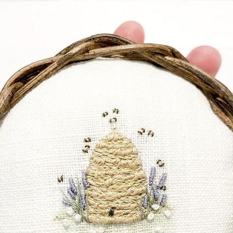 Pins & Needles Stitchery on Instagram: "Might be adding a few of these beehive pincushions to my next little sale. 🐝 . . There’s just something about these tiny little bees! 💛 . . The lovely base has been handwoven by @oldreedbaskets. It just fits so snugly in your hand! 🤎 . . #stitch #stitchery #embroider #embroidery #embroideryart #embroiderylove #pincushion #pincushions #pincushionlove #handwoven #handmadewithlove" Embroidery Honey Bee, Bee Hive Embroidery, Embroidered Beehive, Bee Embroidery Pattern Free, Beehive Embroidery, Tiny Embroidery Ideas, Bees Embroidery, Bee Embroidery Design, Couching Stitch