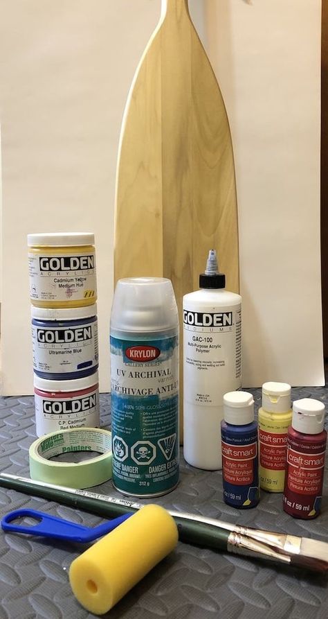 How To Paint A Paddle: Art at the Cottage in Six Easy Steps - MuskokaStyle Painted Canoe Paddles Diy, Boat Paddle Decor, Wooden Paddle Ideas, Painted Oars Paddles Diy, Boat Paddle Ideas Diy Painted Oars, Painted Paddles Ideas, Painting Paddles, Lakehouse Art, Painted Oars Paddles