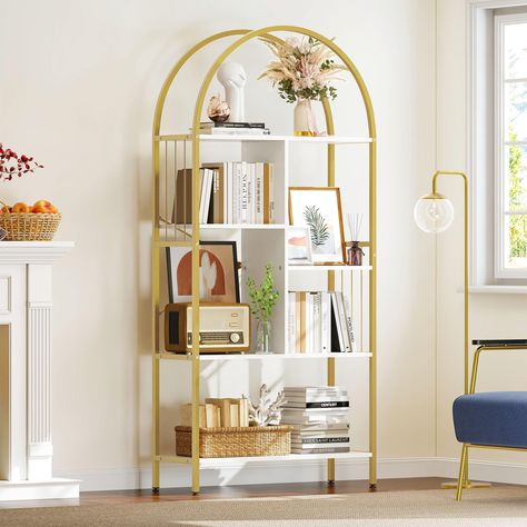 PRICES MAY VARY. P2 Particleboard Artsy arched gold bookshelf: Especially curved and designed with a golden frame, this chic gold bookcase lends a luxurious and elegant vibe to your indoor space, 5-Tier wood open shelf getting books, photos, DVDs and toys organized with style. This fashionable storage solution does its magic Sturdy & Stable Structure: The white and gold bookshelf made of thickened 0.59" particleboard and 0.79"×0.79" metal tubes, provide better durability and load capacity. This Arched Bookshelf, Gold Bookshelf, Rack Shelves, Bookshelf Storage, Etagere Bookcase, Storage Display, Shelves In Bedroom, Bookcase Storage, Display Rack