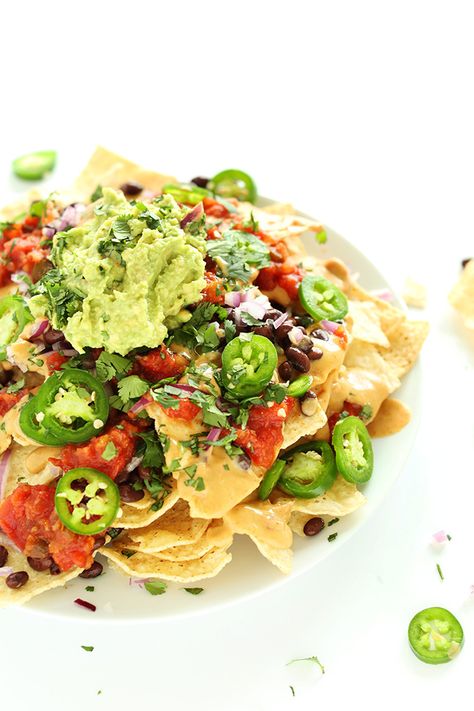 Plate piled high with the Best Damn Vegan Nachos Mexican Nachos, Vegan Queso, Vegan Nachos, Diner Recept, Queso Dip, Vegan Appetizers, Healthy Appetizers, Vegan Foods, Whole Foods