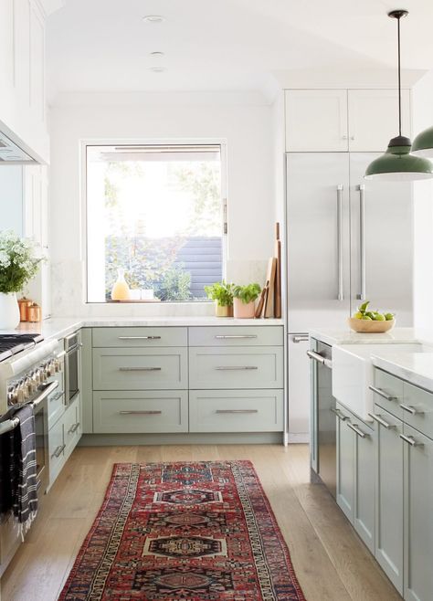 We love a white kitchen. Pale hues bounce natural light, so you flip the switch less. Dark surfaces require more supplemental lighting. Persian Rug Runner Kitchen, Cape Remodel, Persian Rug Kitchen, Arizona Kitchen, Borneo Island, Parisian Kitchen, Latest Kitchen Trends, Kitchen Favorites, Garage Remodel