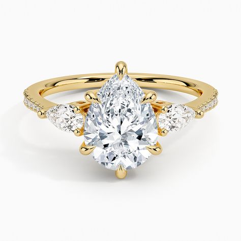 Pear Shaped Opera Accented Three Stone Diamond Engagement Ring - 18K Yellow Gold. Captivating pear-shaped diamonds brilliantly frame the center gem in this classic three stone ring. The petite diamond-adorned band gently tapers for a sleek, romantic finish (1/2 total carat weight). Pear Cut Diamond Engagement Ring, Pear Diamond Engagement Ring, Three Stone Diamond Rings Engagement, Pave Diamond Engagement Rings, Chic Rings, Three Stone Diamond Ring, Lab Diamond Engagement Ring, Rose Gold Diamond Ring, Three Stone Diamond