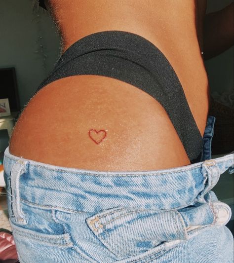 Heart Tattoo Pelvis, Heart Hip Tattoos Women, Heart On Back Tattoo, Small Heart On Hip Tattoo, Cute Placement For Small Tattoos, Red Heart Tattoo On Bum Cheek, Red Heart Tattoo On Hip, Heart On Buttcheek Tattoo, Heart Tattoo Buttcheek