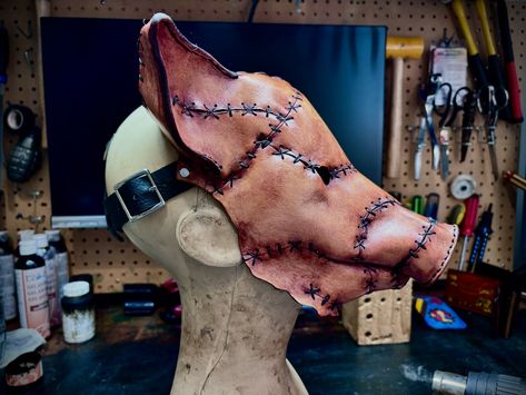 This lil piggy went to the butcher… 😳 Finished up this pig mask and shipped it off to its new home today. Made using veg tan cowhide leather, dyes, paints, thread, wax and sealants #leather #mask #pig #pigmask #halloweenmask #movieprop #prop #costume #costumedesigner #sooke #sookebc #skinznhydez #mrhydezemporiam Butcher Costume, Scare Actor, Halloween Props Scary, Pig Mask, Pig Costumes, Mascaras Halloween, The Butcher, Leather Mask, Tan Cowhide